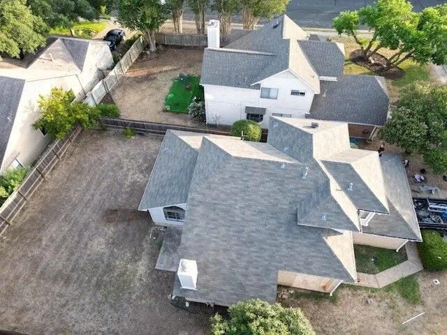 A property with a driveway and trees in Buda