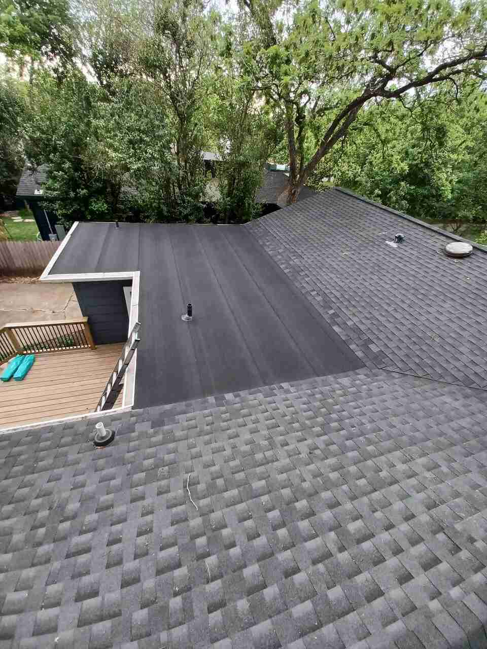 A house roof with trees in the background in Pflugerville