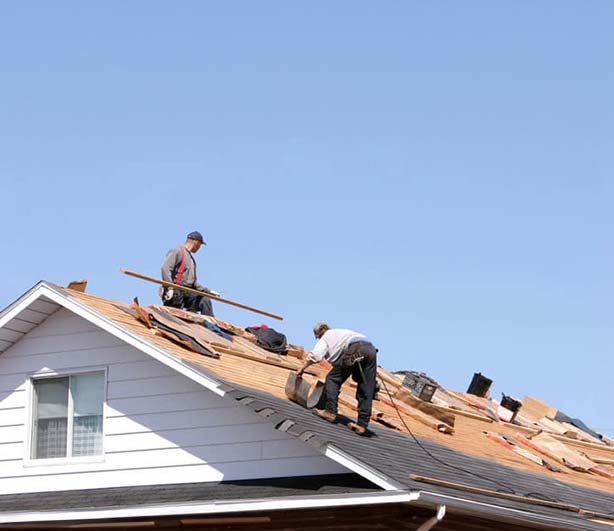 Workers Repairing A Roof In Austin, TX