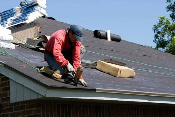 A person working on a roof in Round Rock