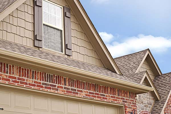 A close-up of a house with new shingles